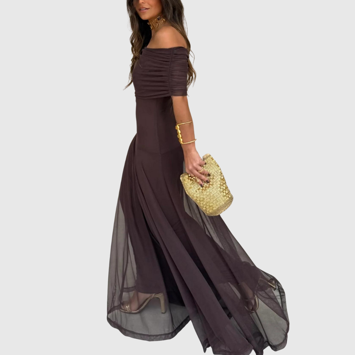 Eleva il tuo stile con l'abito lungo in chiffon con spalle scoperte Lorenzo. Leggero, fluido ed elegante per ogni occasione. Acquista ora!