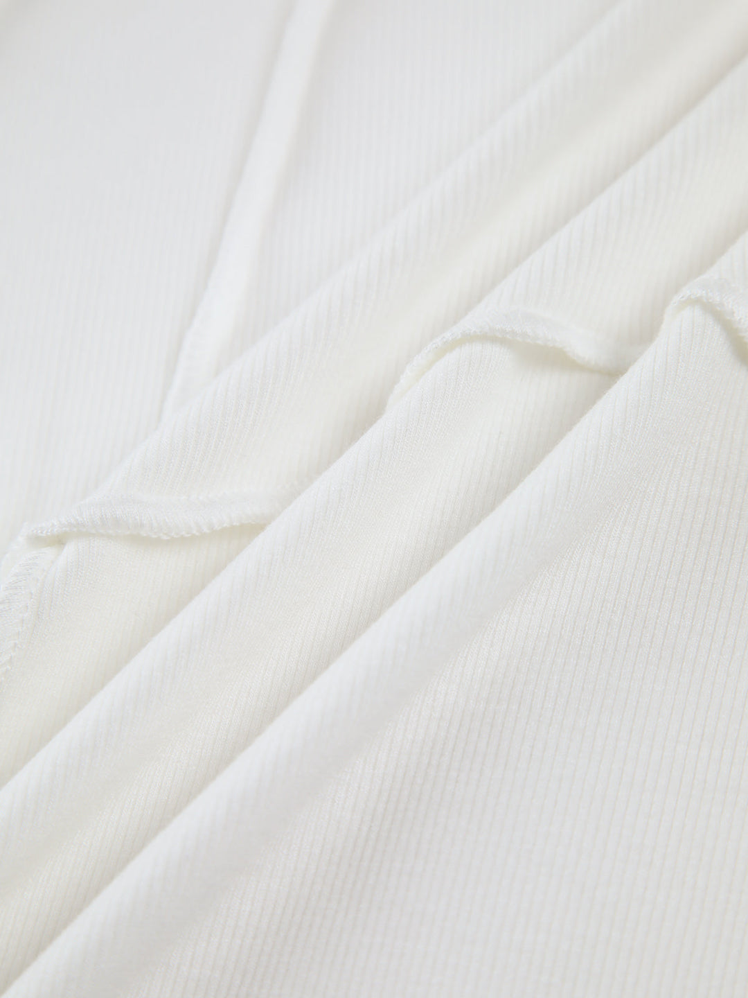 Top elegante a maniche lunghe con bordino