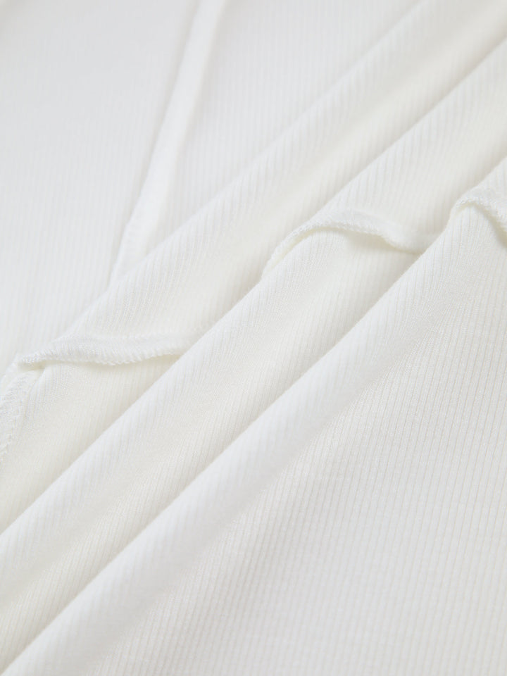 Top elegante a maniche lunghe con bordino